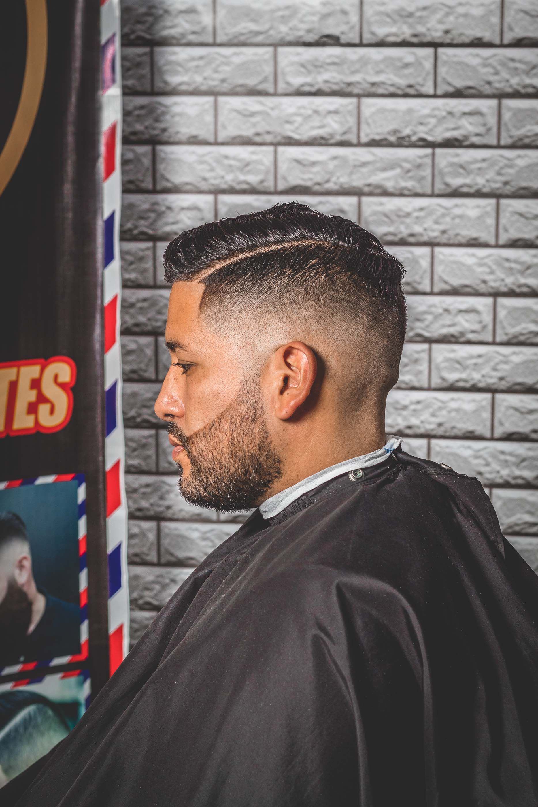 A low fade with a hard part and a sharp line-up