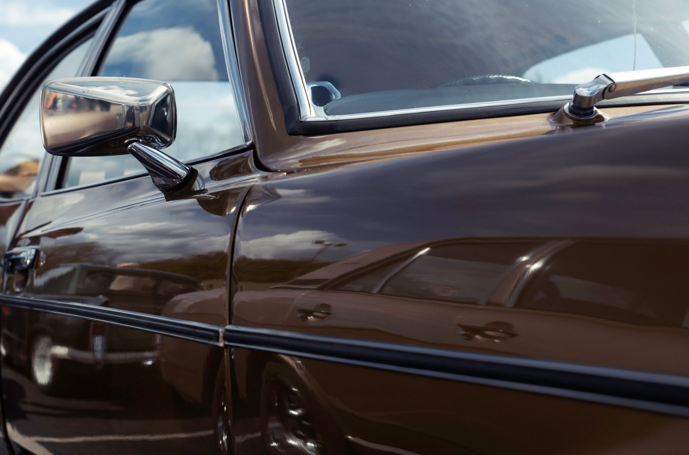 The side of a brown sedan, after