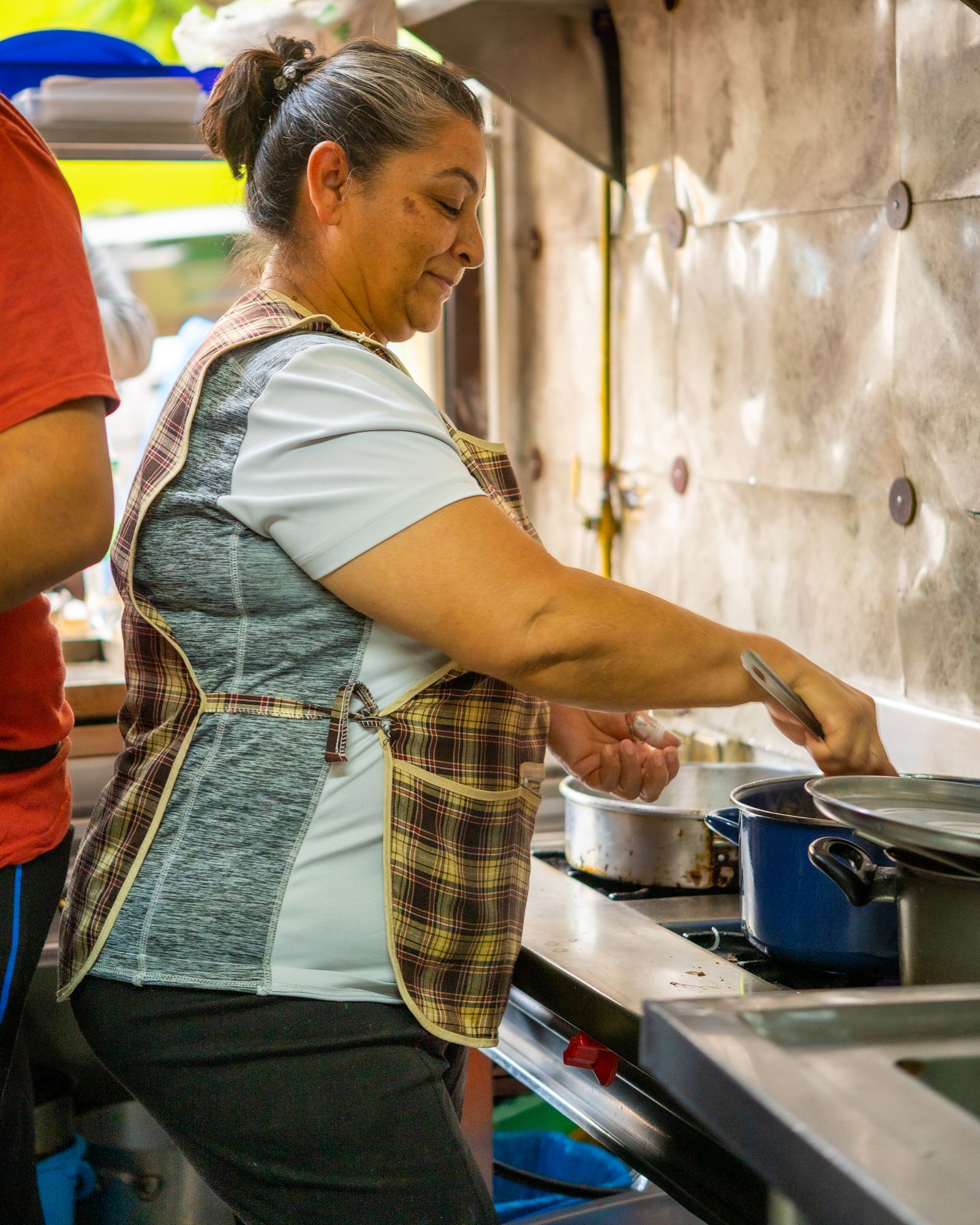 Lupita cooking in the La Palma kitchen